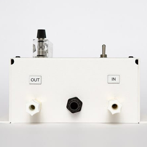 This image shows the bottom view of the Pool Link 200 series automatic CO2 Feed Sytem controller. This bottom shows an in and out line port and a power cable port. Also seen in view is the toggle switch and flow meter for the unit.